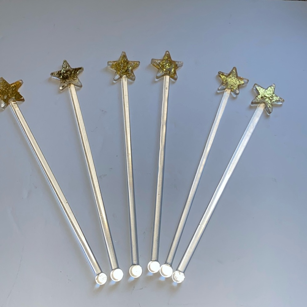 Vintage glass star stir sticks. Decorated with gold.